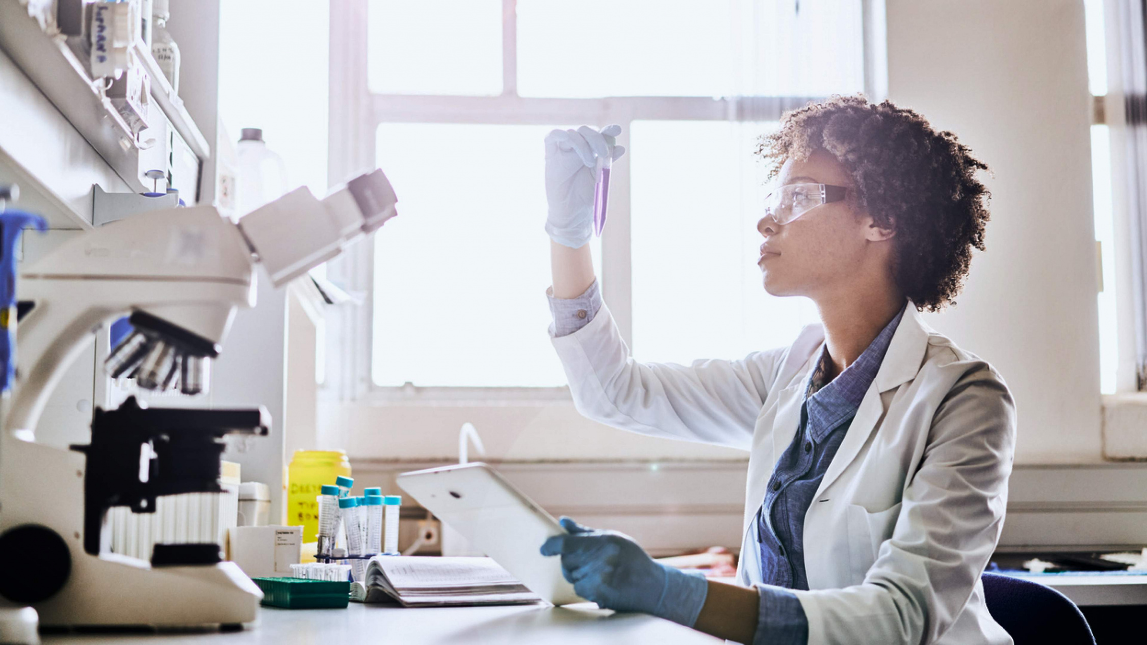 Person in a business suit in a science lab