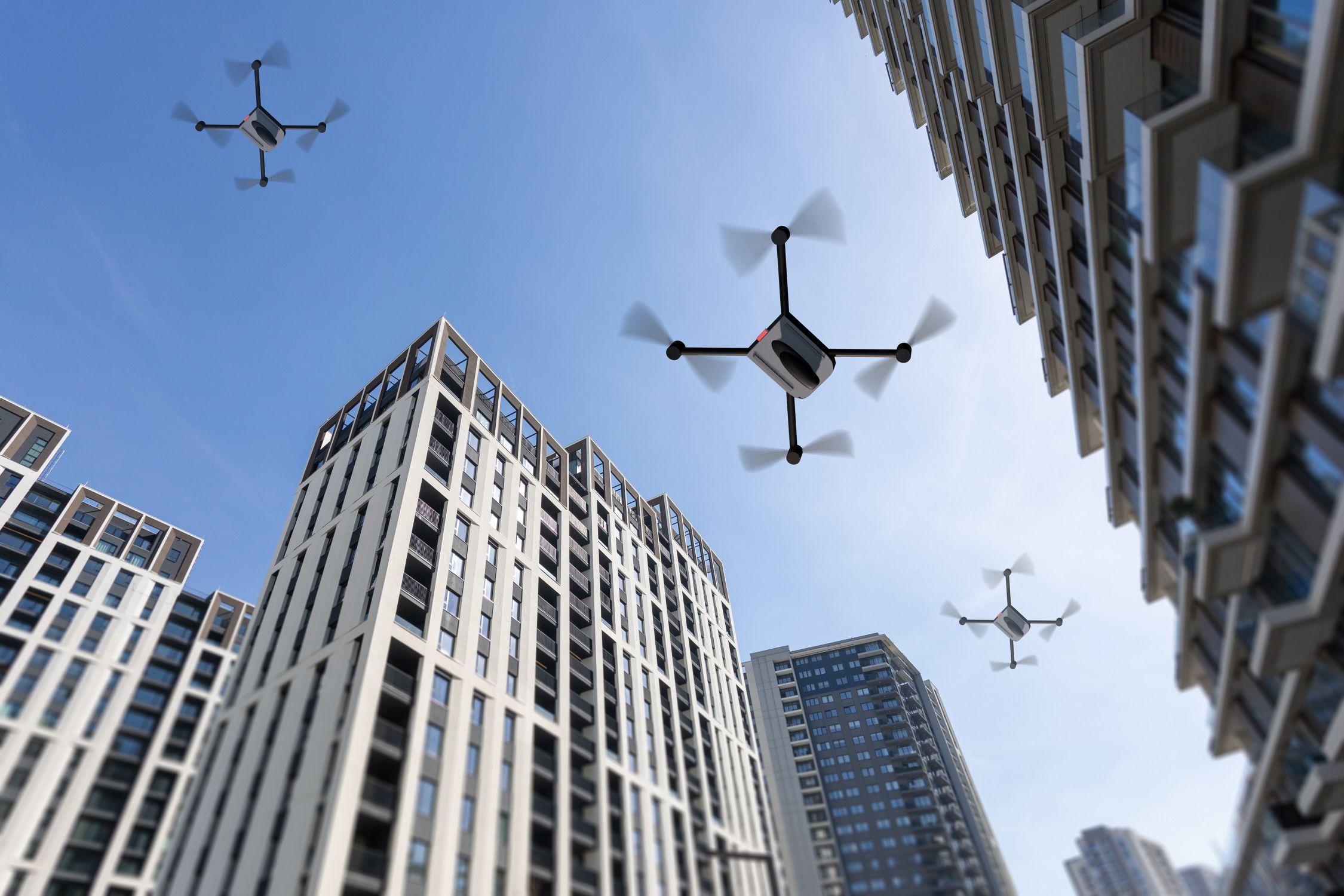 Image of drones flying between large buildings